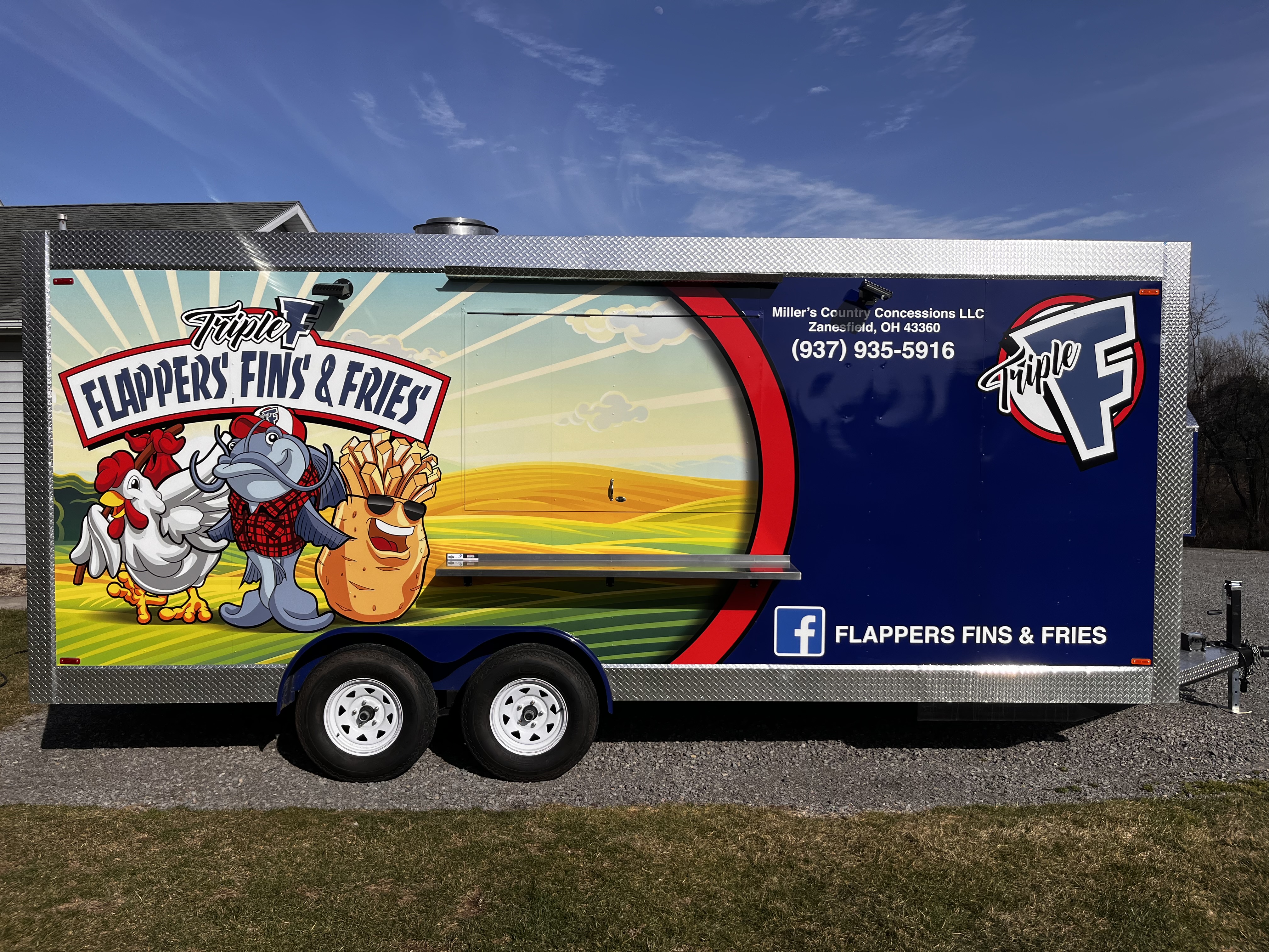 Flappers Fins and Fries food trailer with colorful mascot wrap